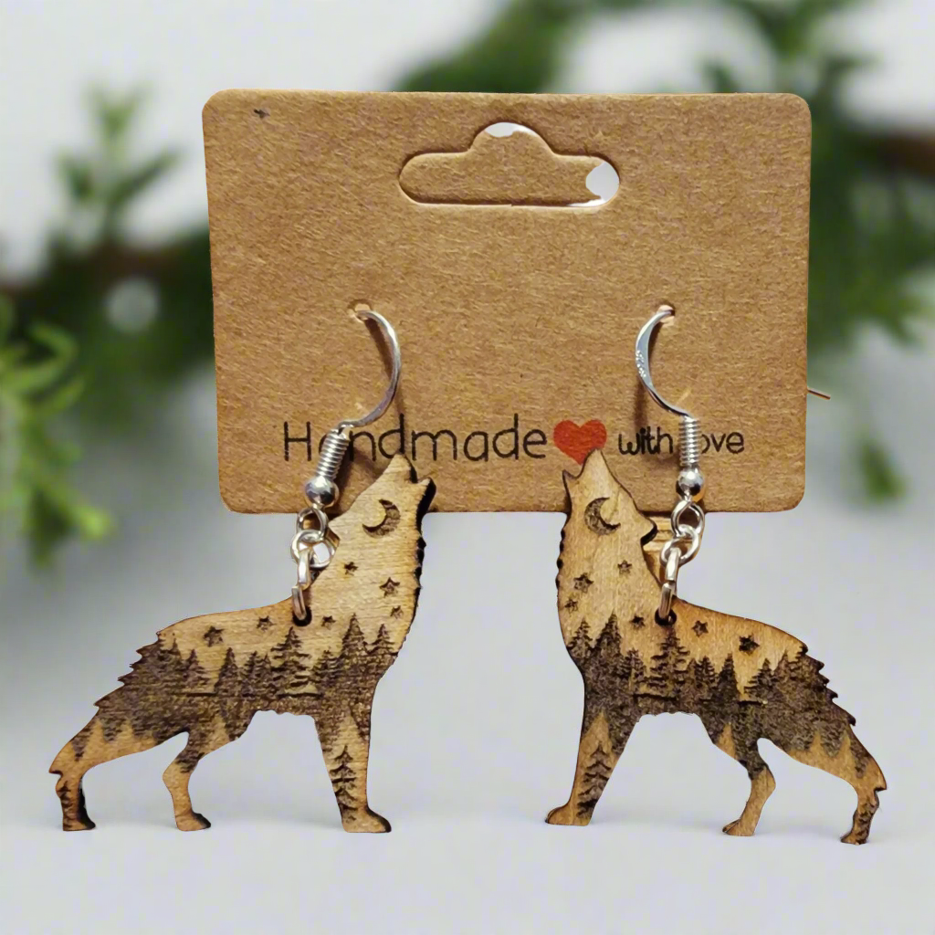 Wolf Earrings with trees, moon and starts in natural wood on white background