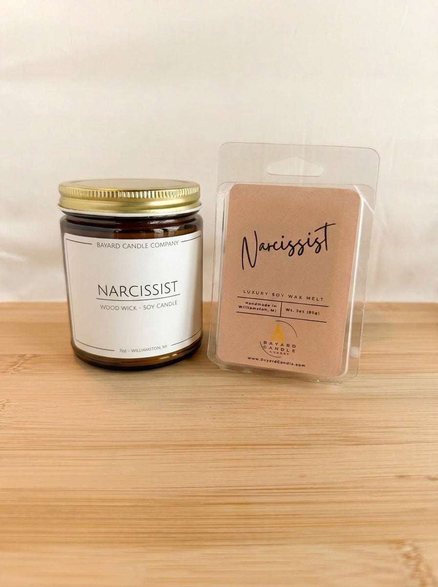 Narcissist wood wick soy candle with matching wax melt set on wood surface