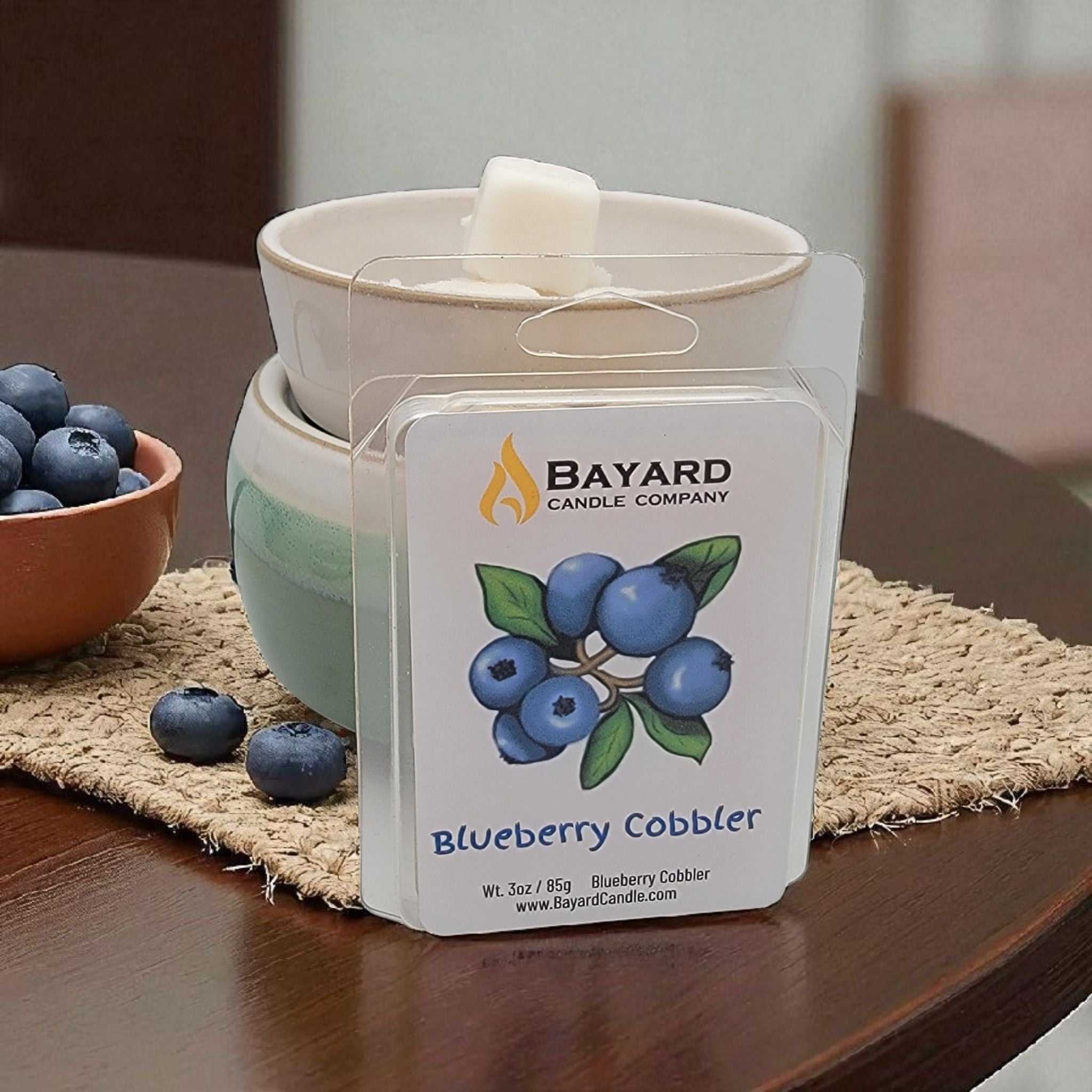 Blueberry Cobbler Soy Wax Melt on a dark wood table