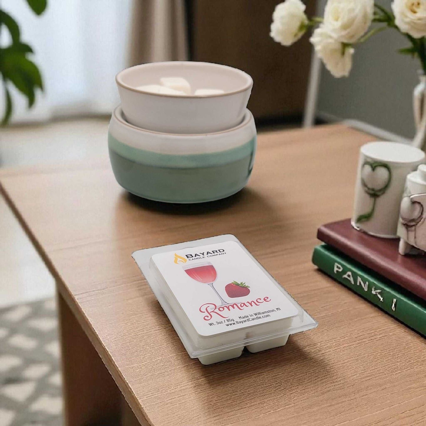 Romance Soy Wax Melt on a table with a wax warmer