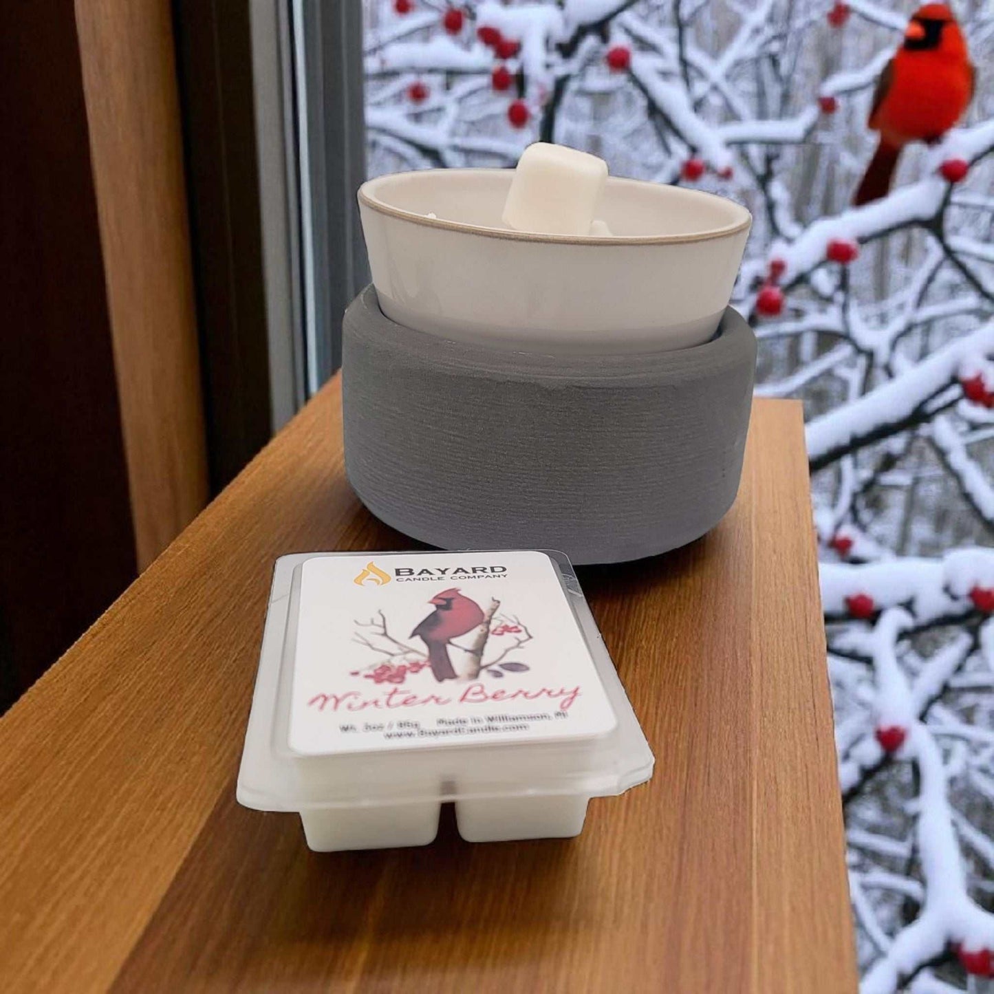 Winter Berry Soy Wax Melt on a table with a wax warmer