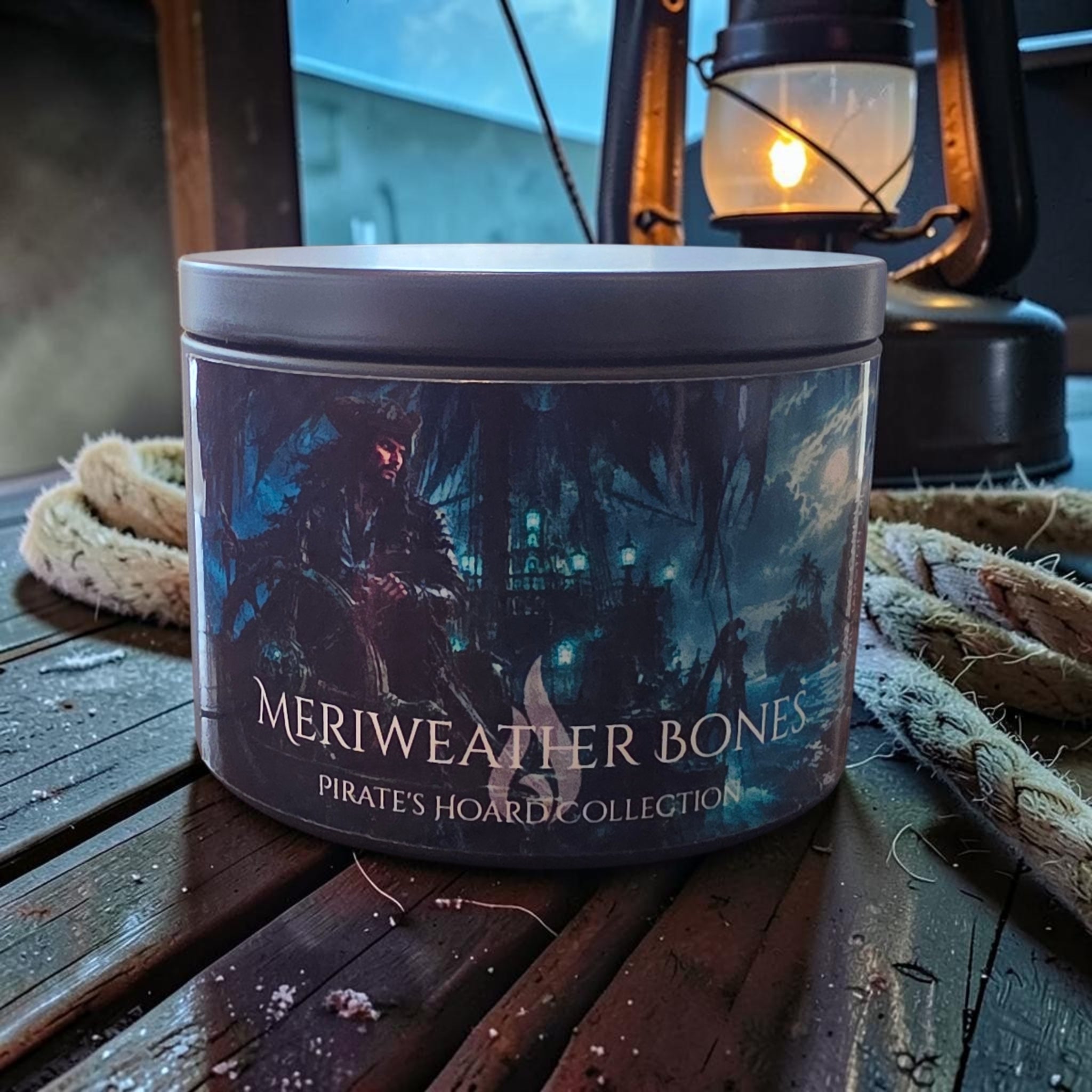 A cylindrical tin candle labeled &