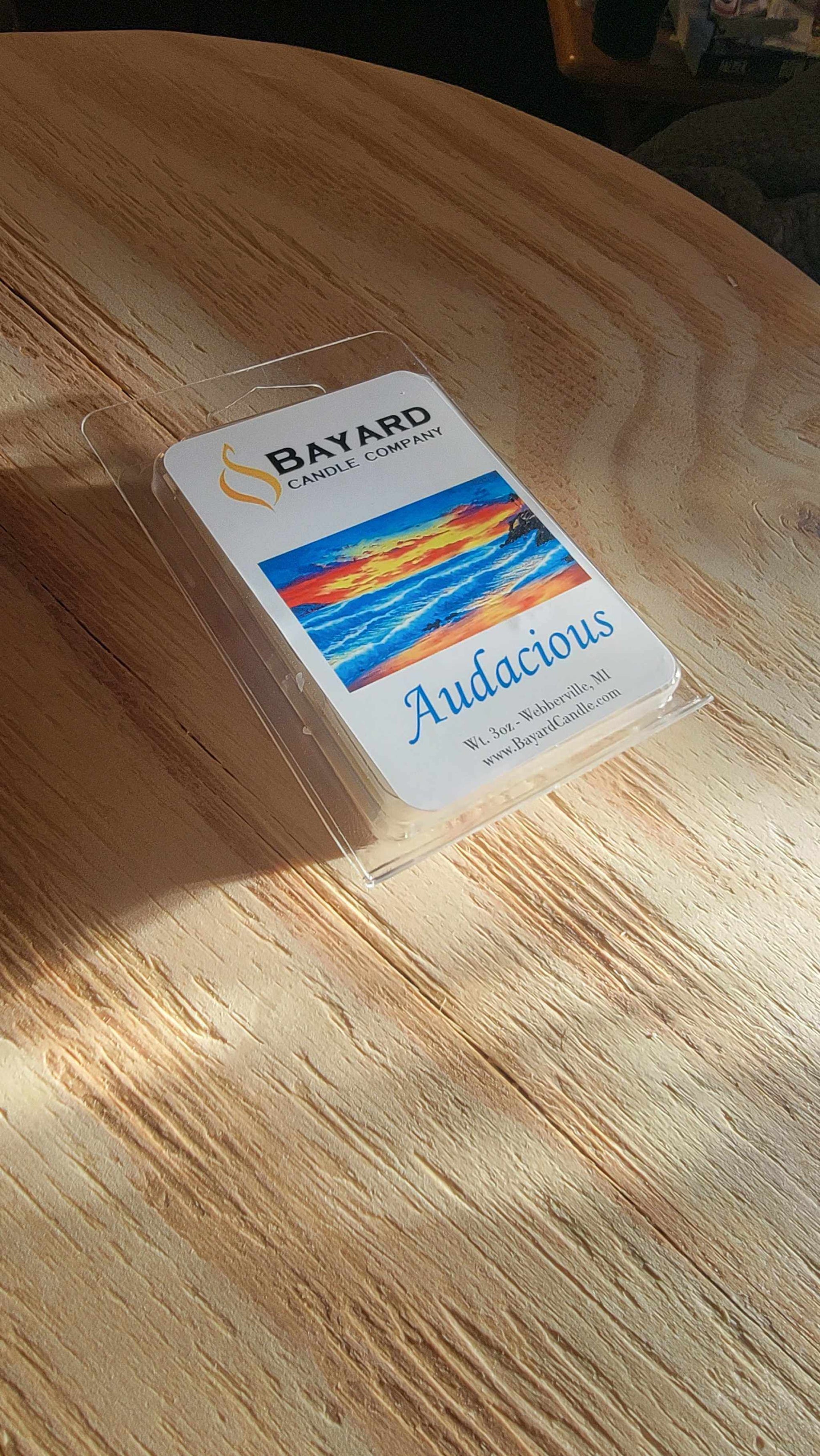 Audacious Soy Wax Melt on a table in a golden light
