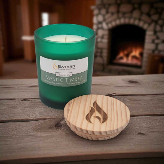 Frosted Mystic Timber Soy Candle on a rustic wooden table 