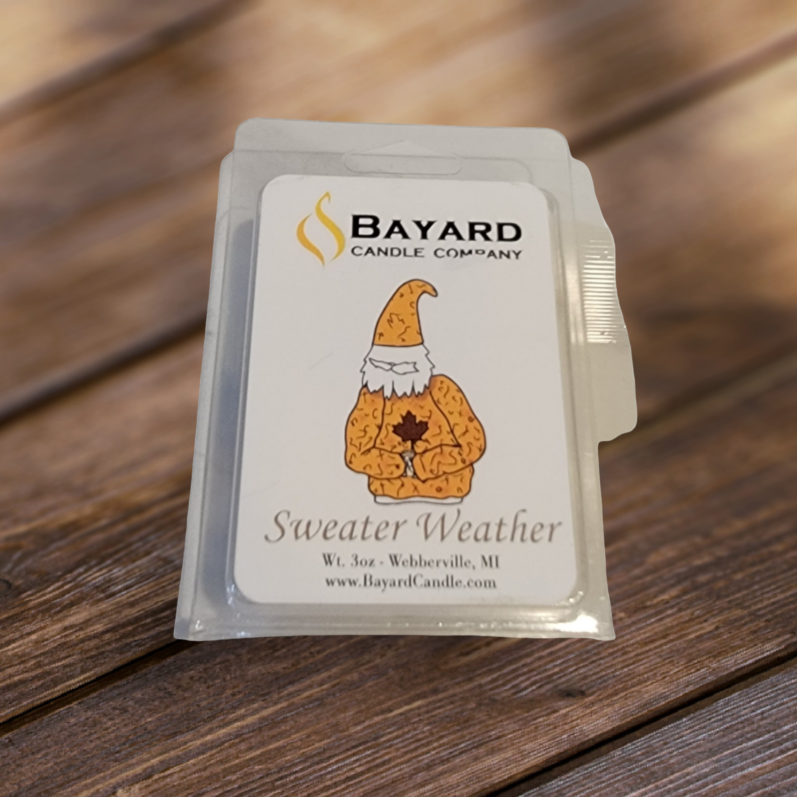 sweater weather soy wax melt on a wood table