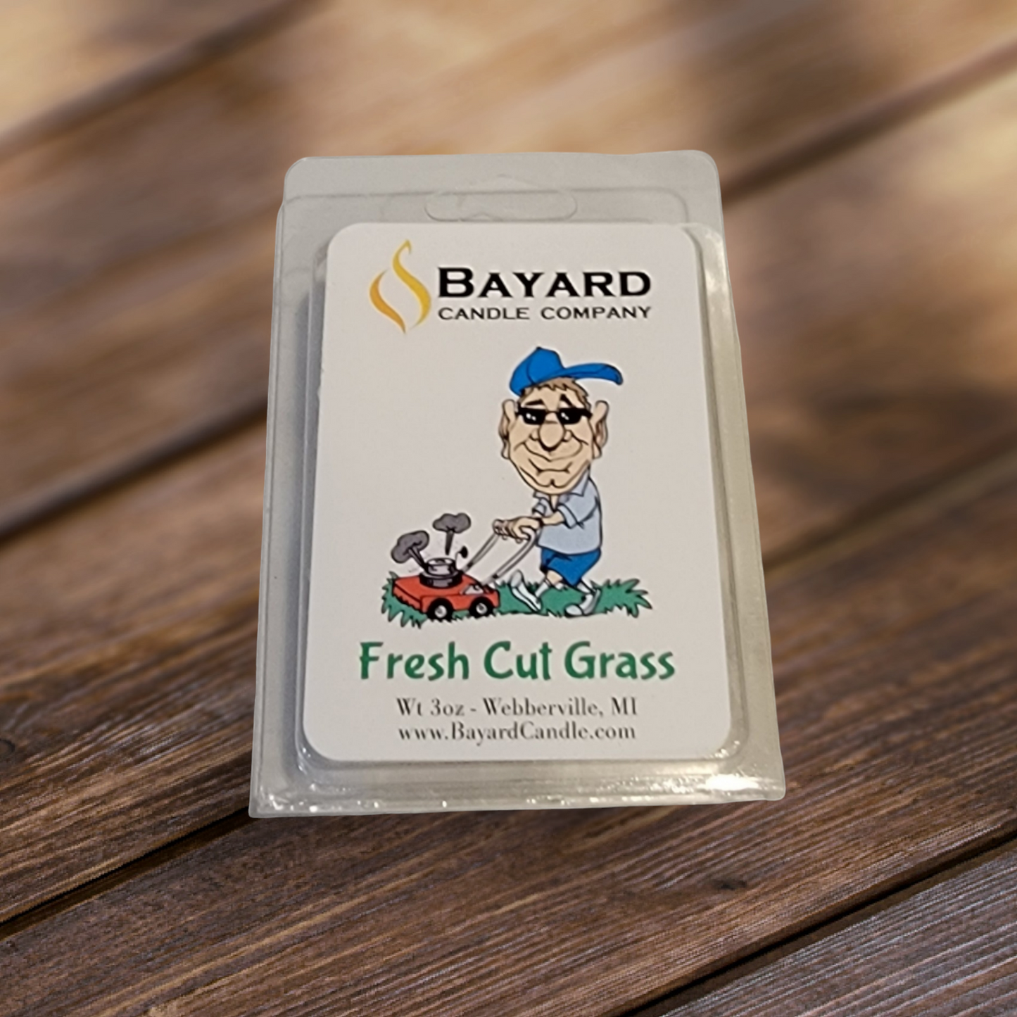 Fresh Cut Grass Soy Wax Melt on a wood table