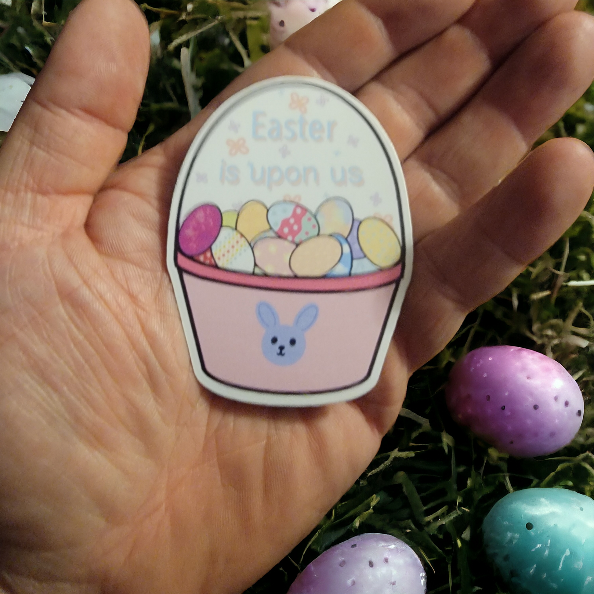Easter is upon us sticker in a hand