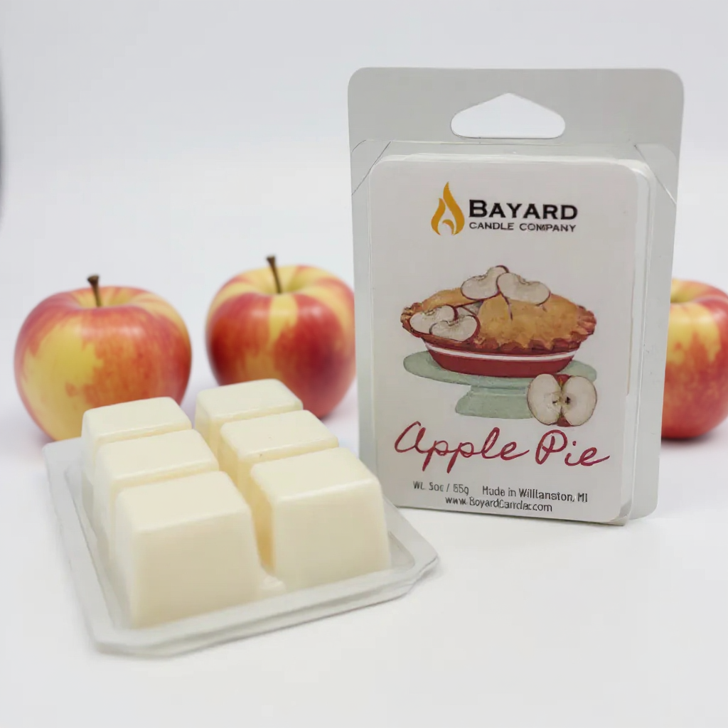 Bayard Candle Company Apple Pie wax melts with packaging and apples on a white background