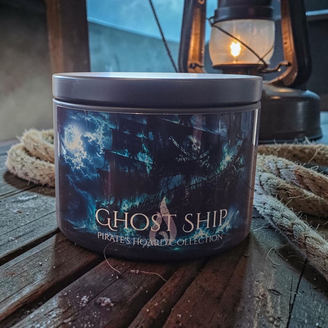 A cylindrical candle tin labeled &