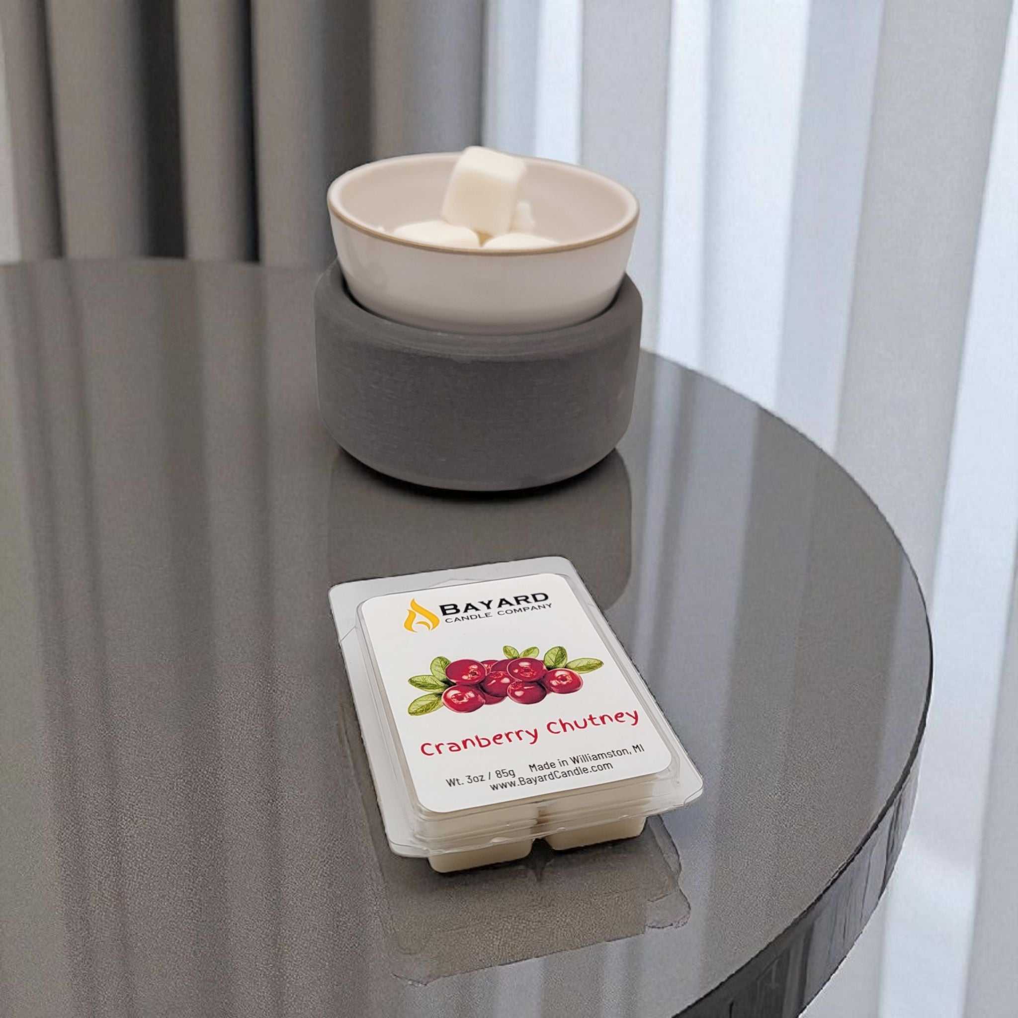 Cranberry Chutney Soy wax melt on a table with a wax melter