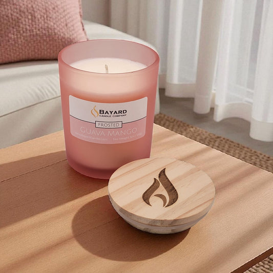 Frosted Guava Mango Soy Candle on a table