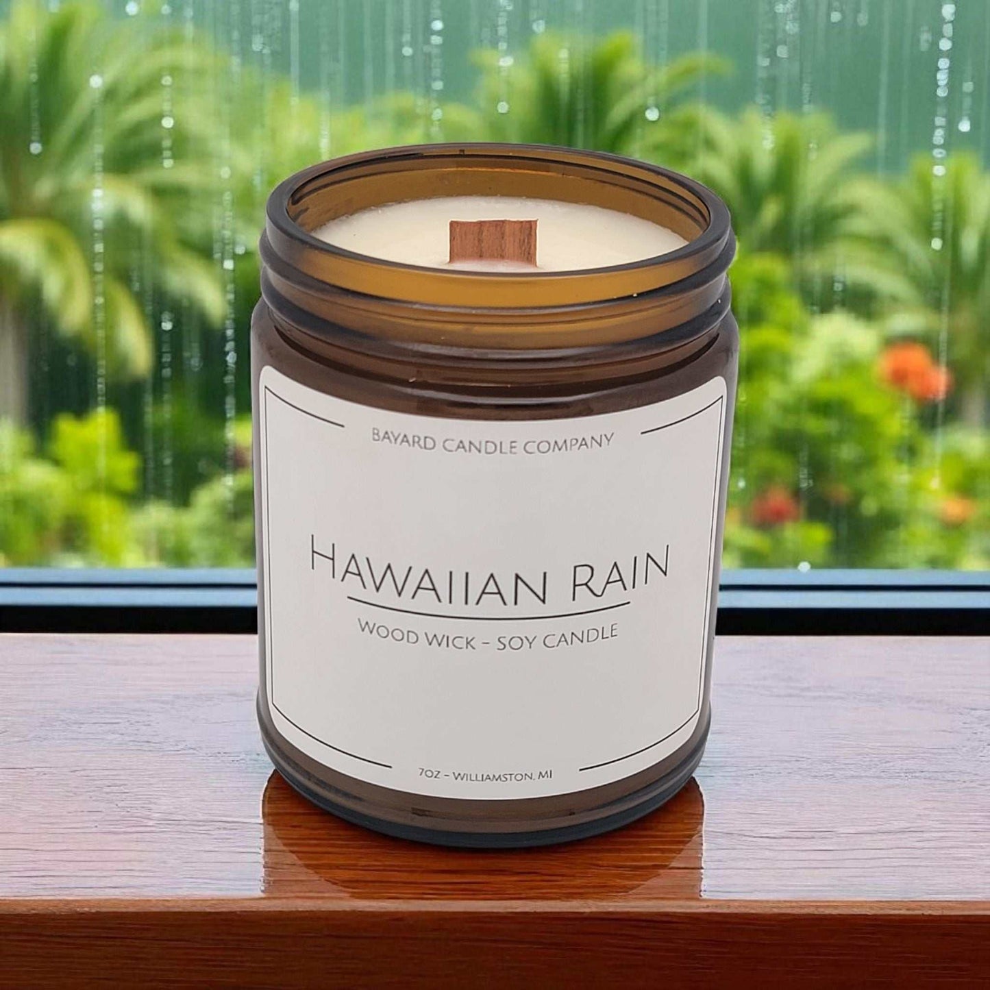 Hawaiian Rain Wood Wick Candle by a rainy window in Hawaii 