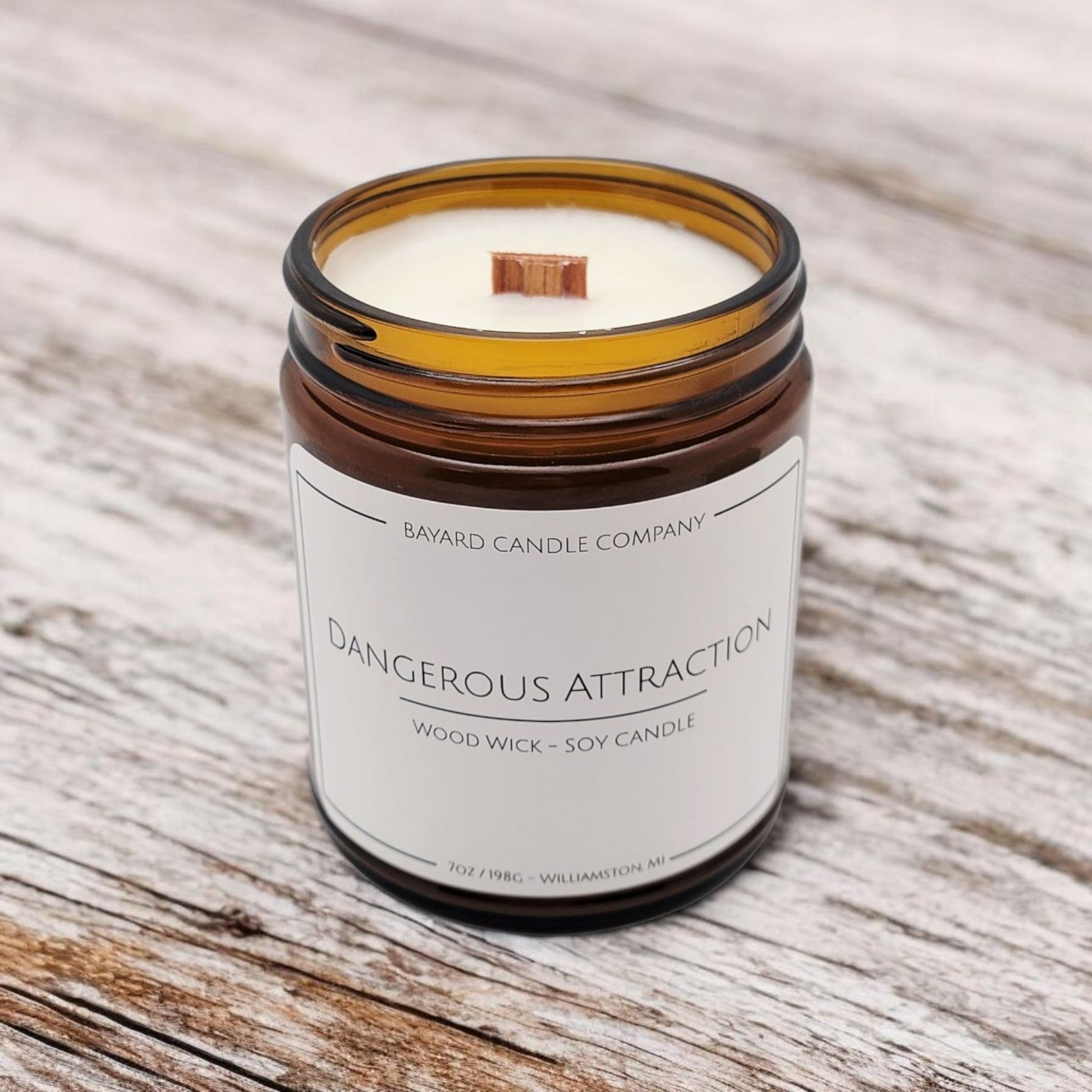 Dangerous Attraction Wood Wick Candle on a wood table