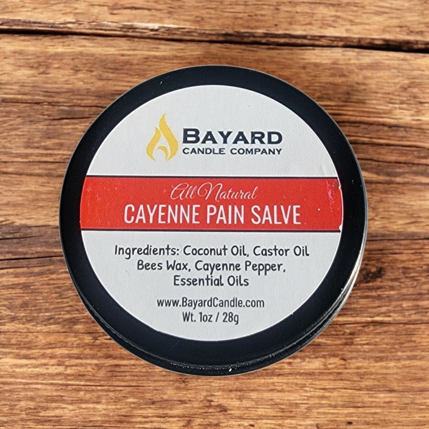 Cayenne Pain Salve on a wood table 