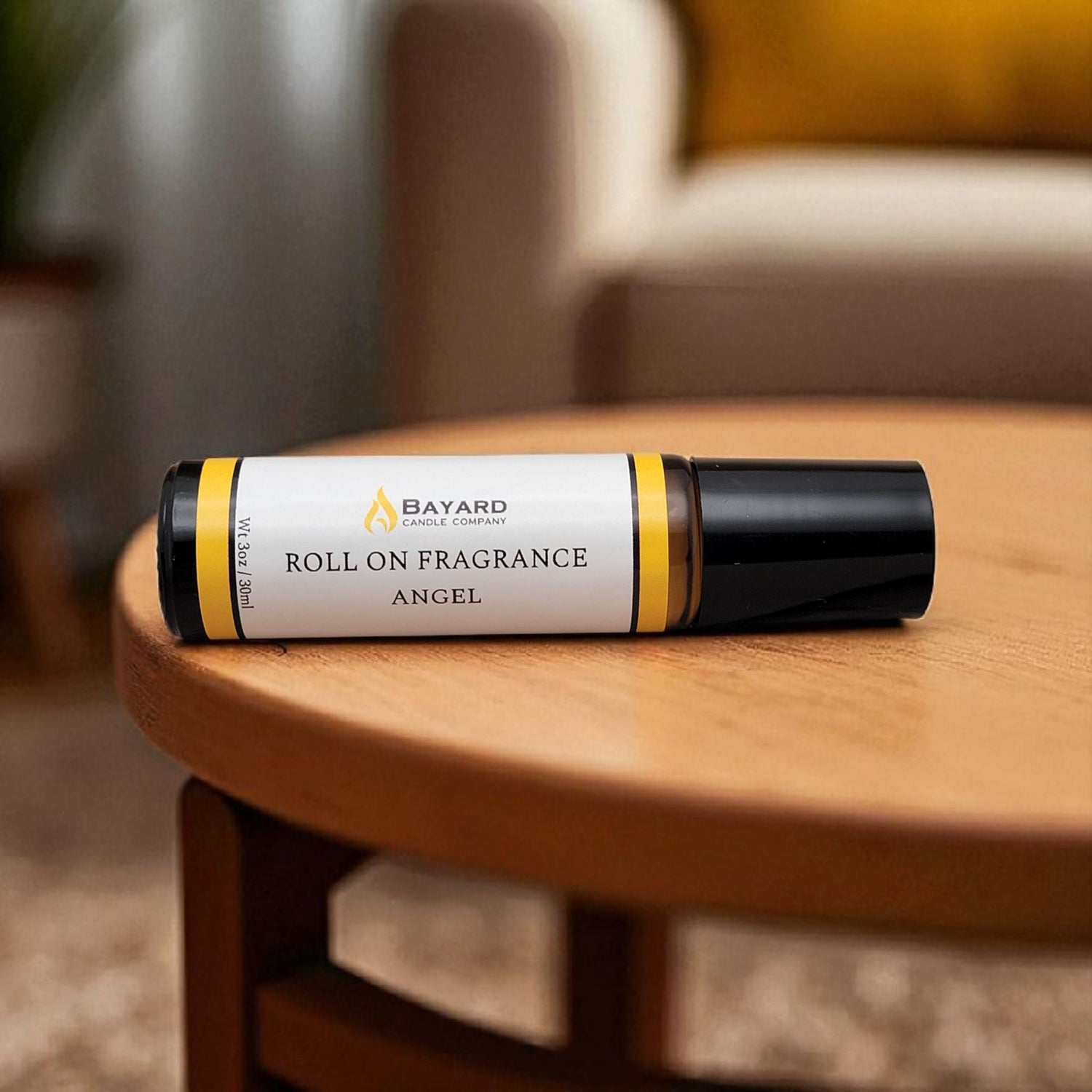 Angel Roll On Fragrance on a wood table 