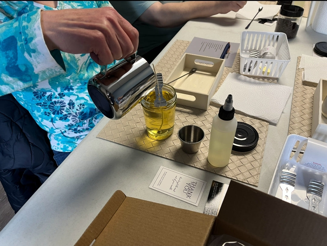 Candle Making Classes - Student Pouring wax into a Candle jar.