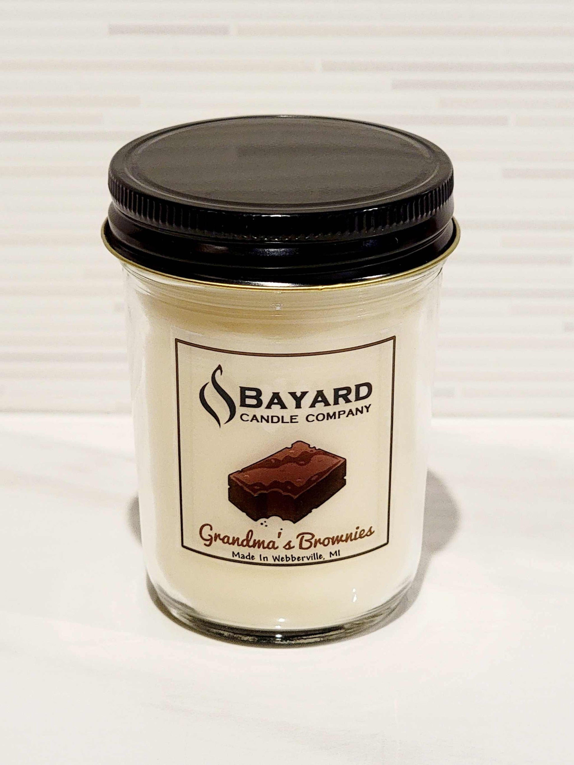 randmas brownies soy candle with the top on