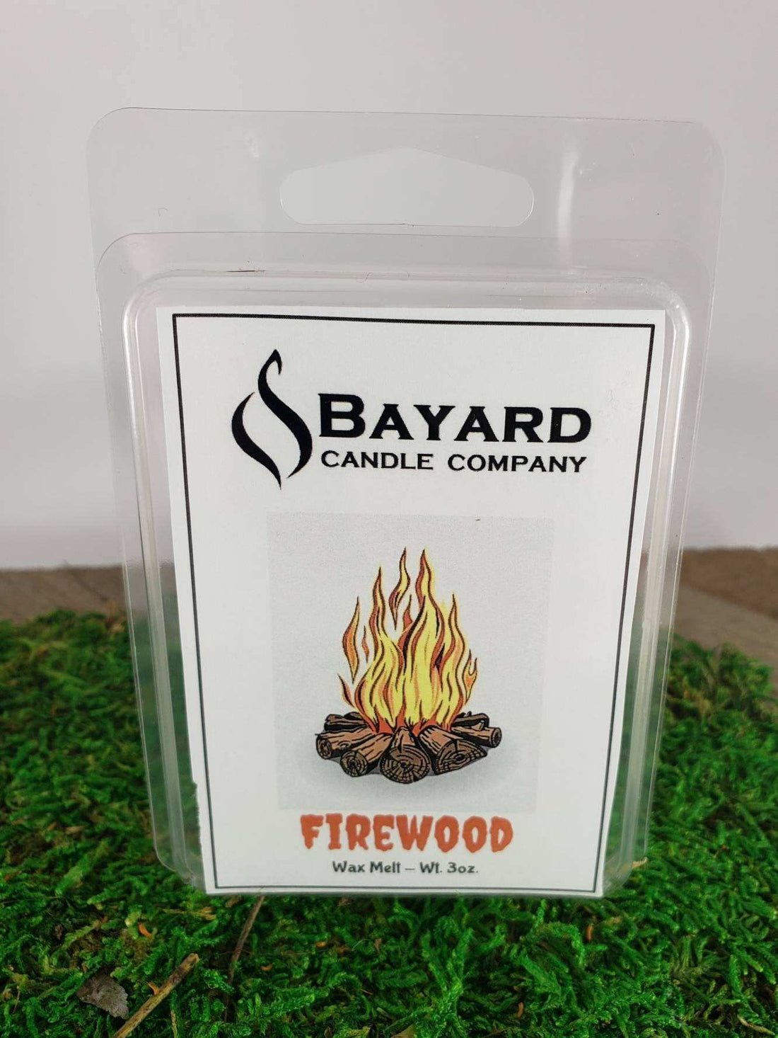 firewood soy wax melt on grass